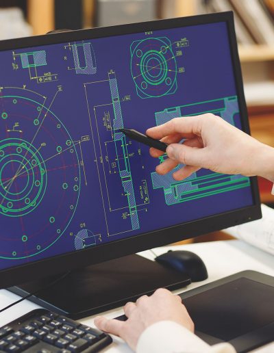Engineer working on cad scheme.  Engineer using computer tools.